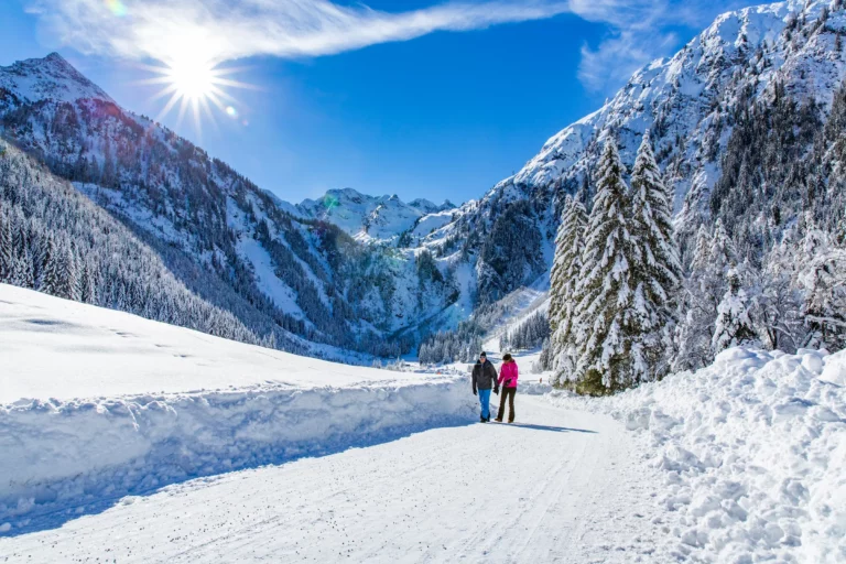 Winter hiker in a snowy valley Winter hiker in a snowy valley – winter holiday in Ramsau am Dachstein